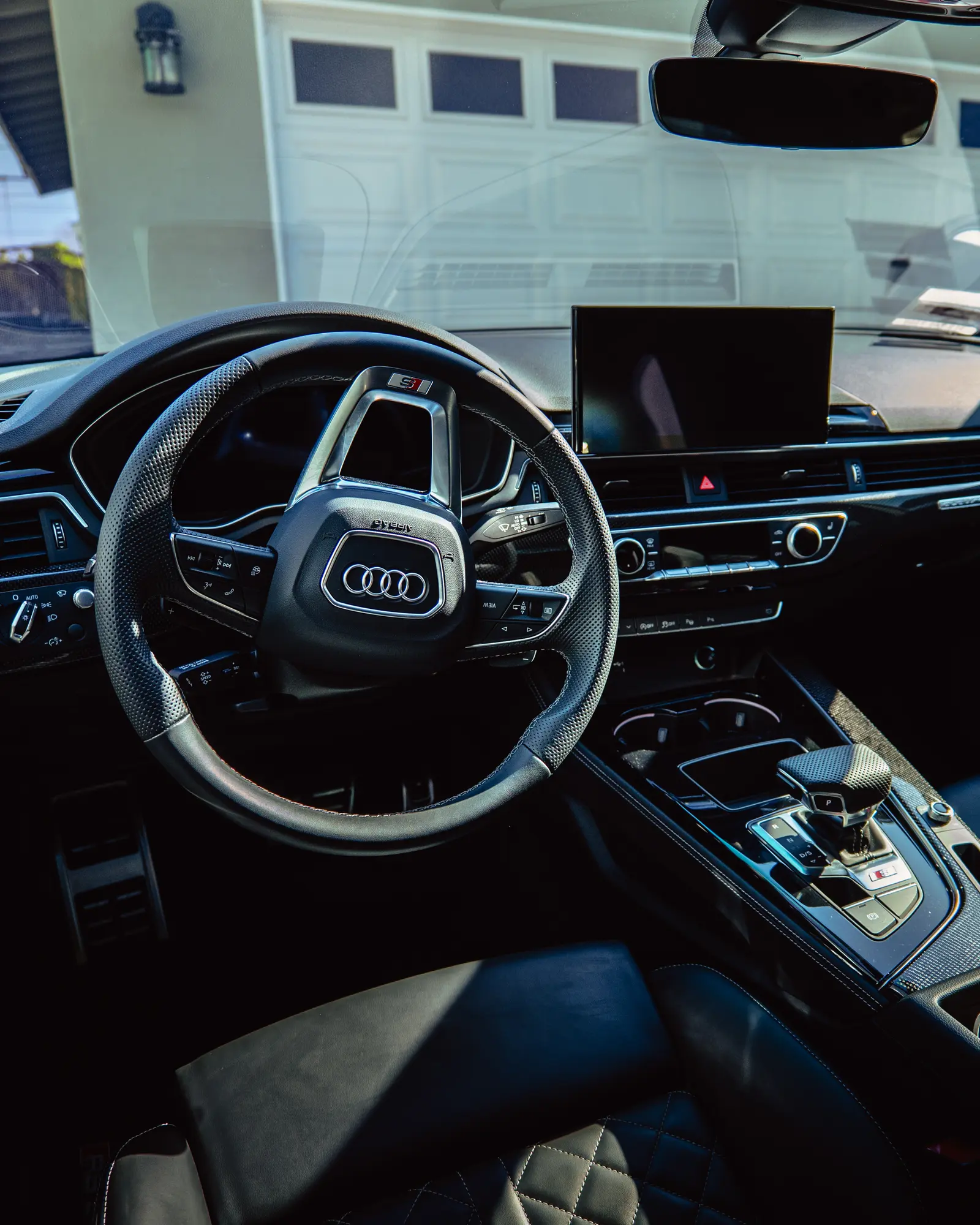 Audi steering wheel, dash and seats after an interior detail