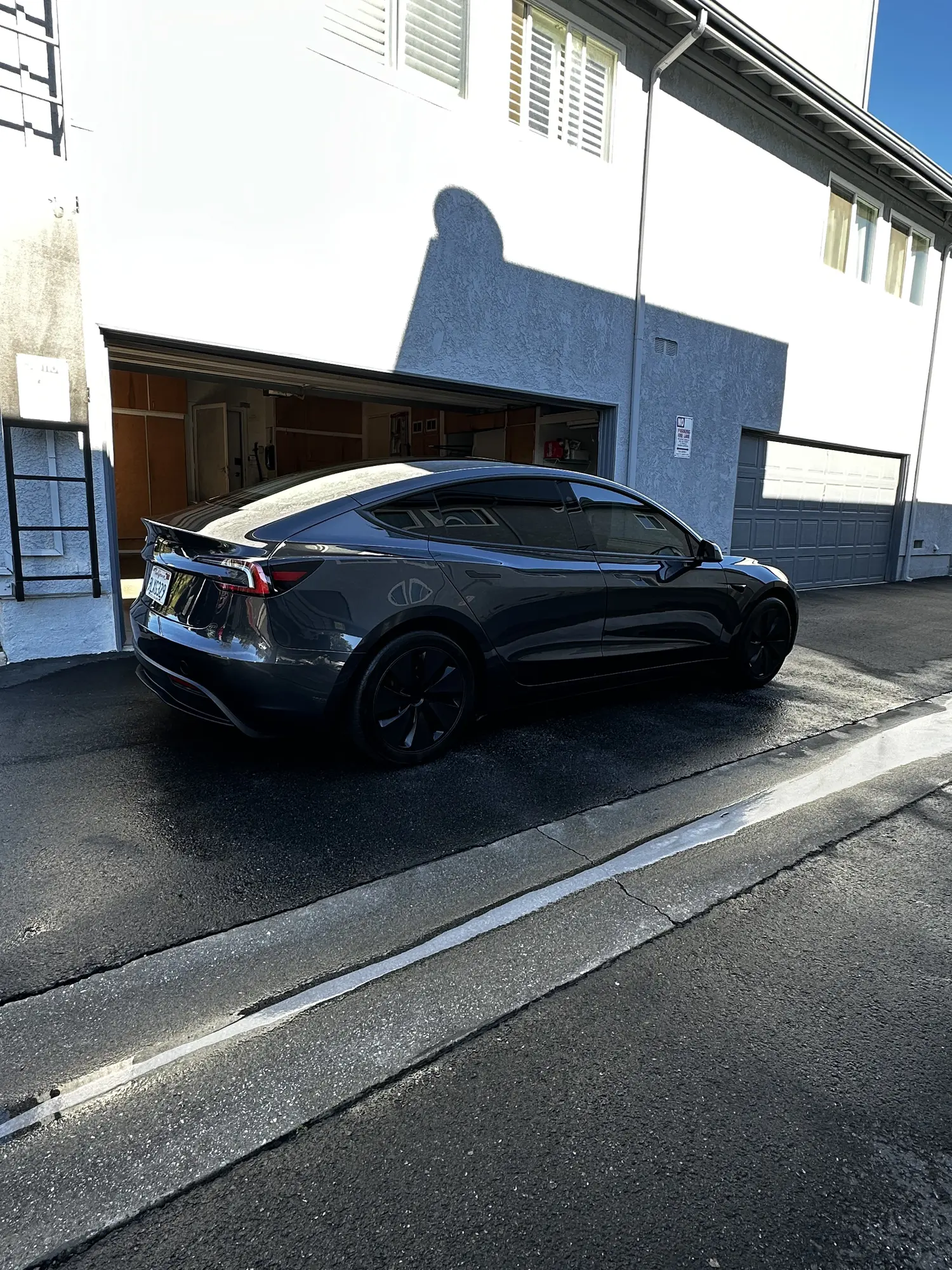Gray Tesla Model Y after a mobile wash