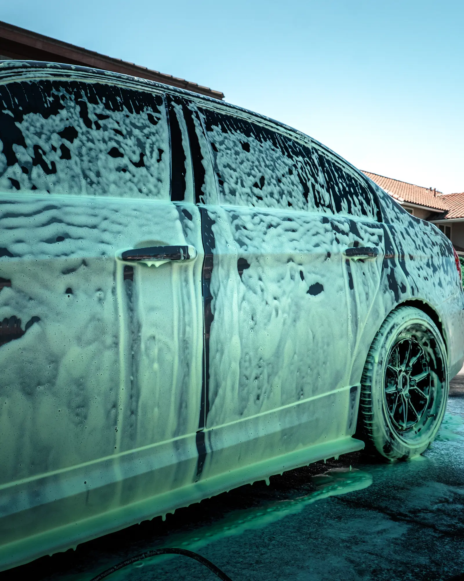 BMW covered in foam during a hand wash