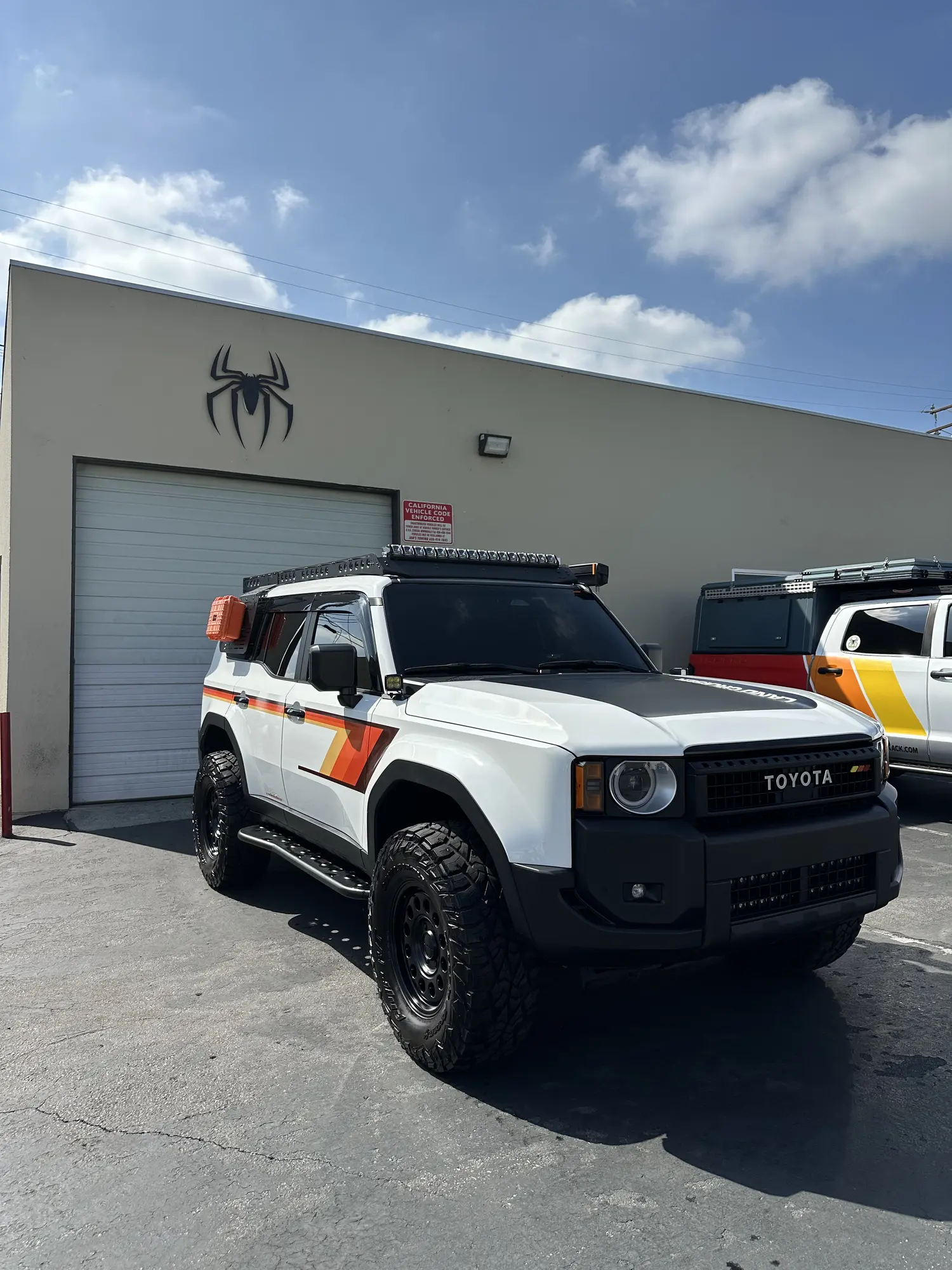 White Toyota Land Cruiser detailed at a business lot