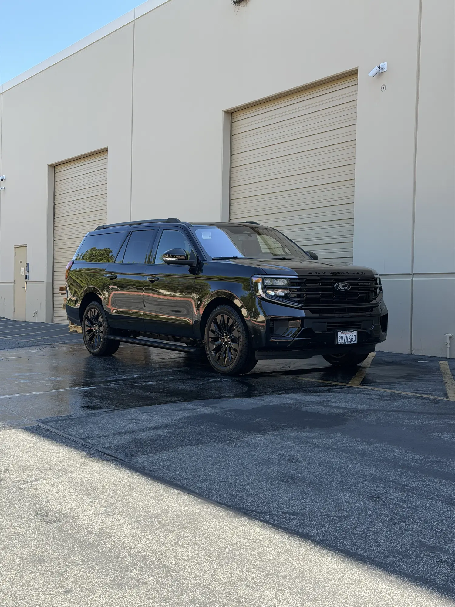 Black Ford Expedition washed at a business lot