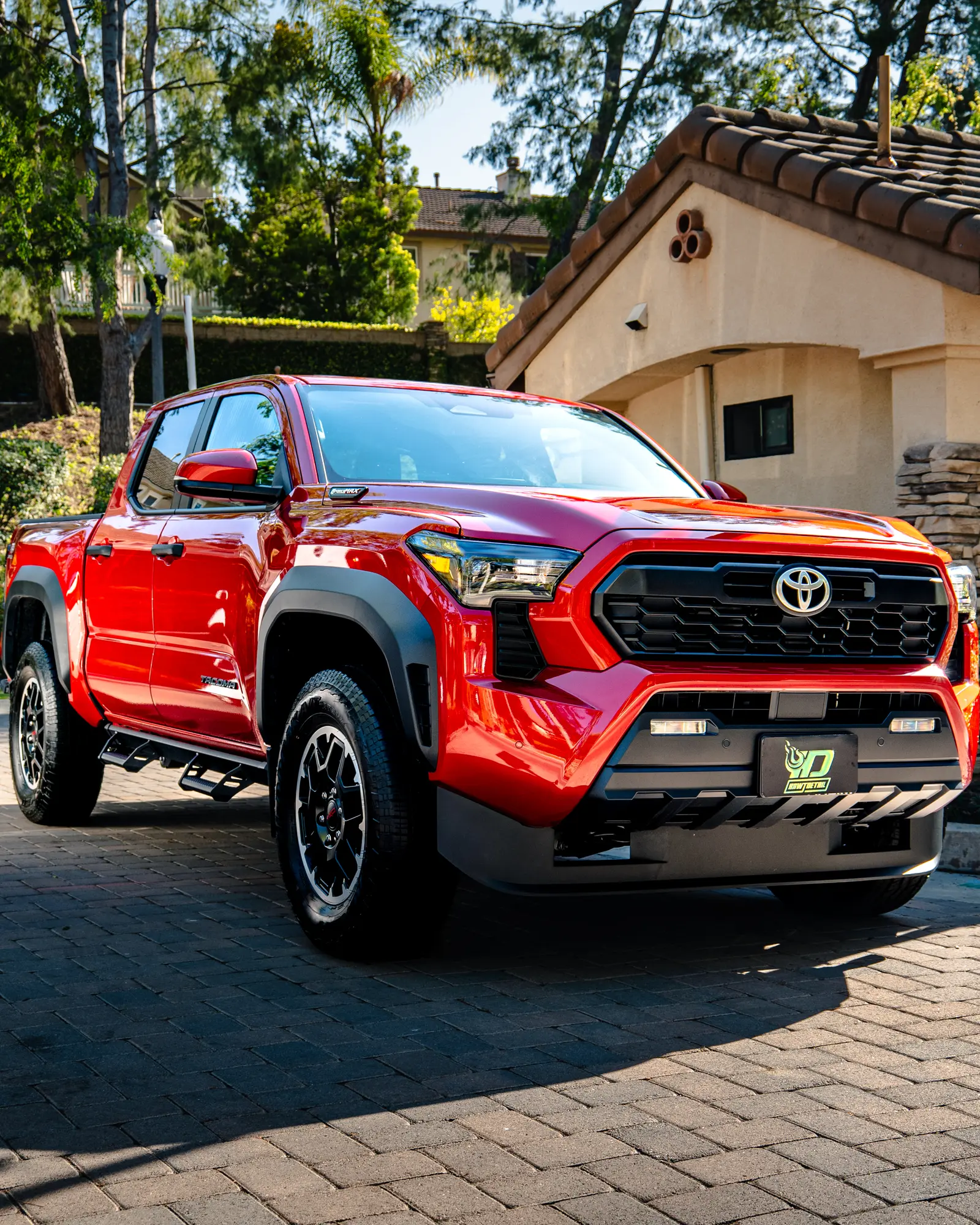 Red Toyota Tacoma after an exterior detail